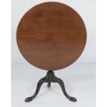 Mahogany tilt top tripod table, 19th Century, circular one piece top tilting over a wrythen