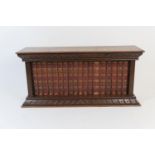 Walter Scott's novels, presented in an oak stand comprising 18 Morocco bound volumes, width 57cm,