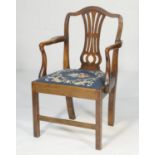 Provincial ash open armchair, circa 1820, having a splat back and needlework upholstered drop-in