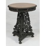 Indian carved hardwood table, late 19th Century, circular top with moulded egg and dart border and