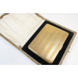 George V 9ct gold cigarette case, Birmingham 1921, rectangular form with engine turned vertilinear