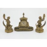 French ormolu clock garniture, the timepiece with Roman numerals set within a square pillar form