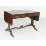 Regency mahogany sofa writing table, circa 1820, the top having two drop leaves with rosewood