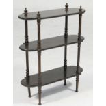 Victorian coromandel etagere, having three shaped shelves supported on turned columns and feet,