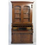 Victorian mahogany cylinder front bureau bookcase, circa 1870, ogee moulded cornice over two