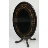 Victorian ebonised and inlaid loo table, circa 1880, the oval top inlaid with fern leaves and fine