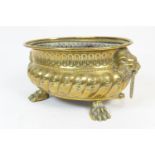 Dutch brass jardiniere, oval form with lion's mask ring handles and paw feet, 31cm (Viewing is by