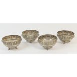 Four Indian white metal small bowls, late 19th Century, each with a pierced border punctuated with