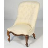 Victorian rosewood and cream fabric upholstered nursing chair, deep buttoned back over a