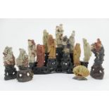 Chinese carved soapstone collection of figures comprising nine Taoist Immortals carved in coloured