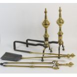 Set of Edwardian brass fire irons, 70cm; also a pair of brass mounted wrought iron fire dogs, height