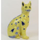 French faience pottery cat in the style of Gallé, having an allover yellow glaze punctuated with