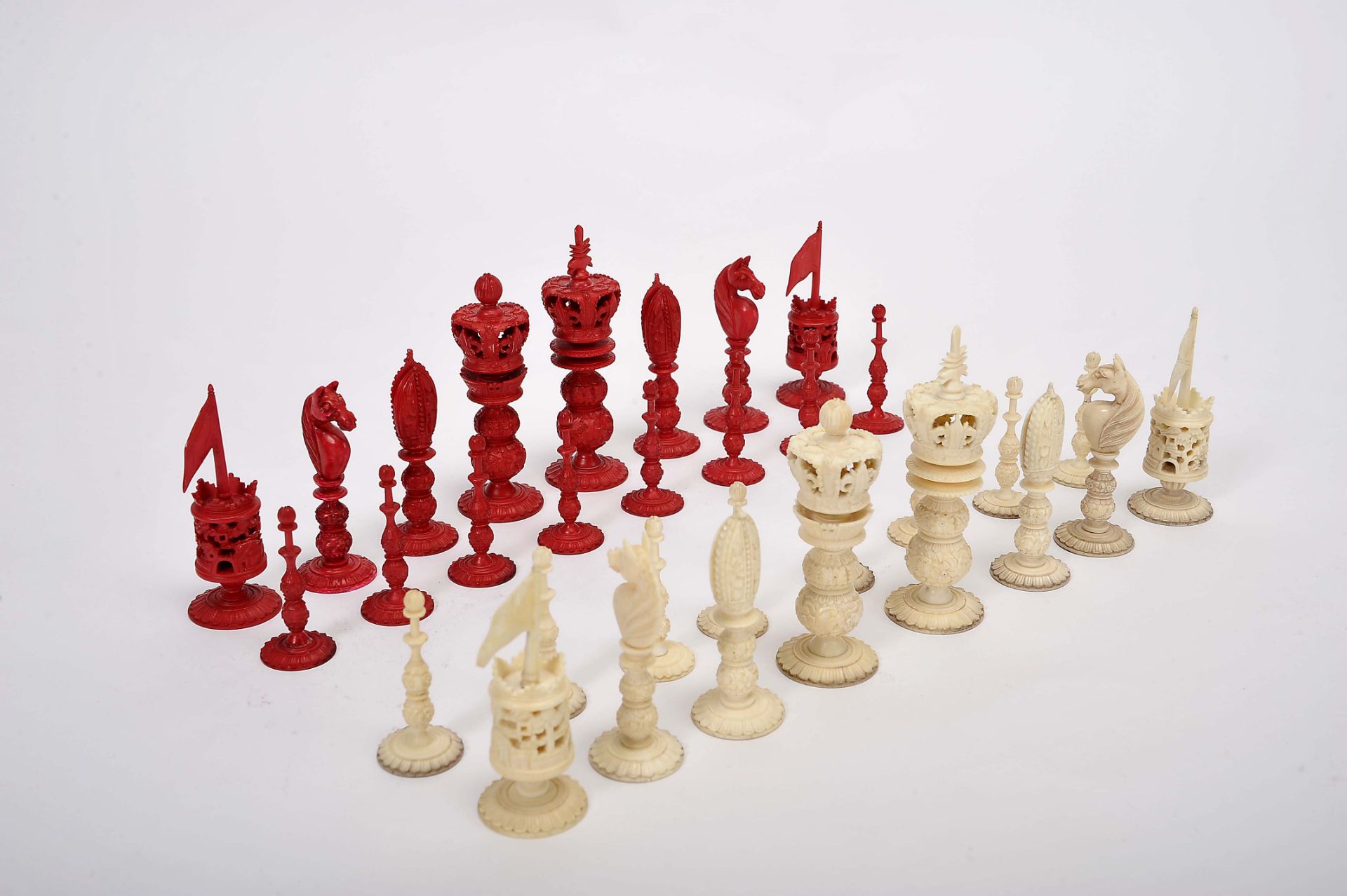 Chess piecesChess pieces, "Burmese style" carved ivory being one of the sets dyed red, Chinese,