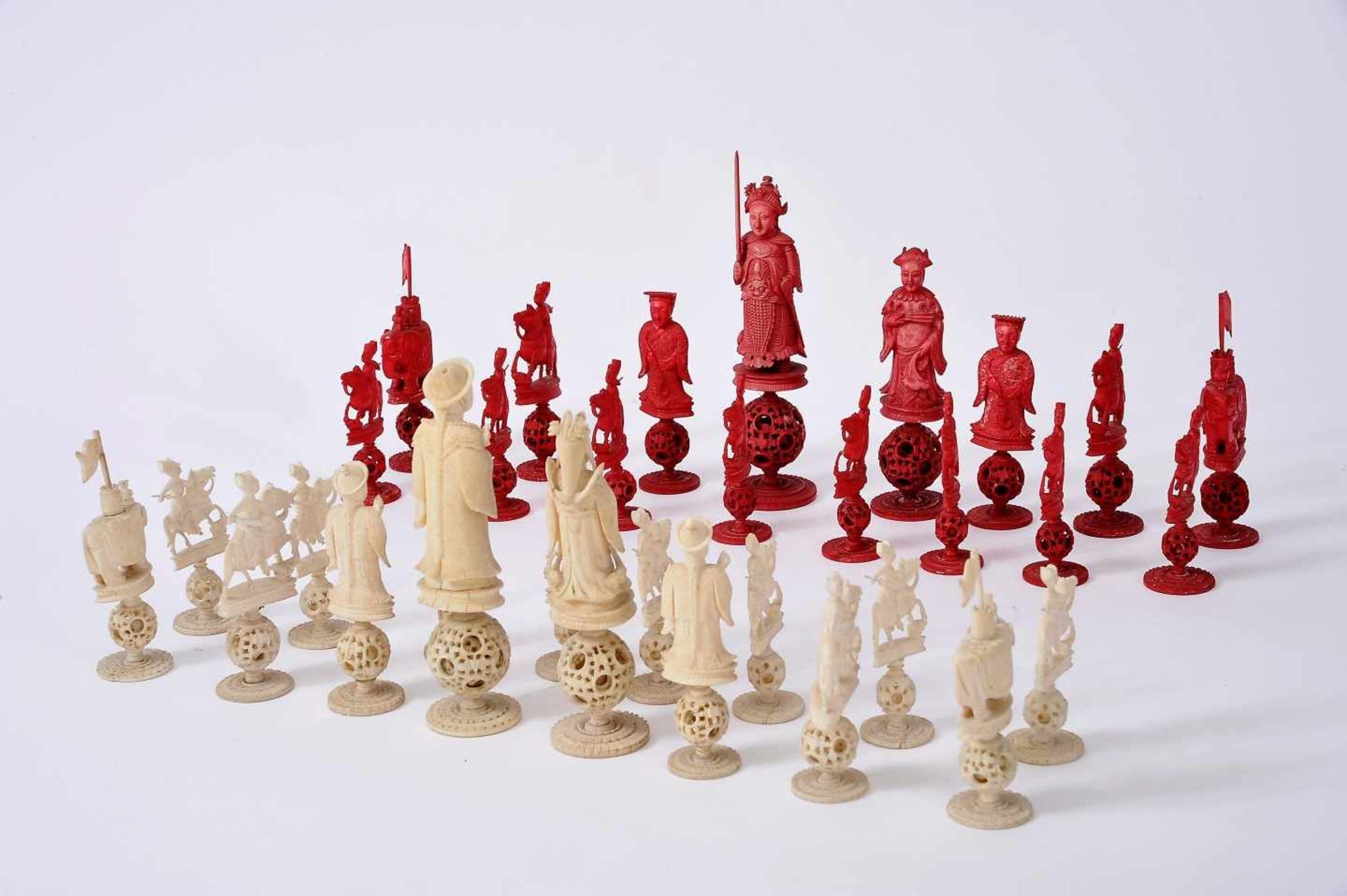Chess PiecesChess Pieces, carved ivory with all the pieces based on "Ball of happiness", one of