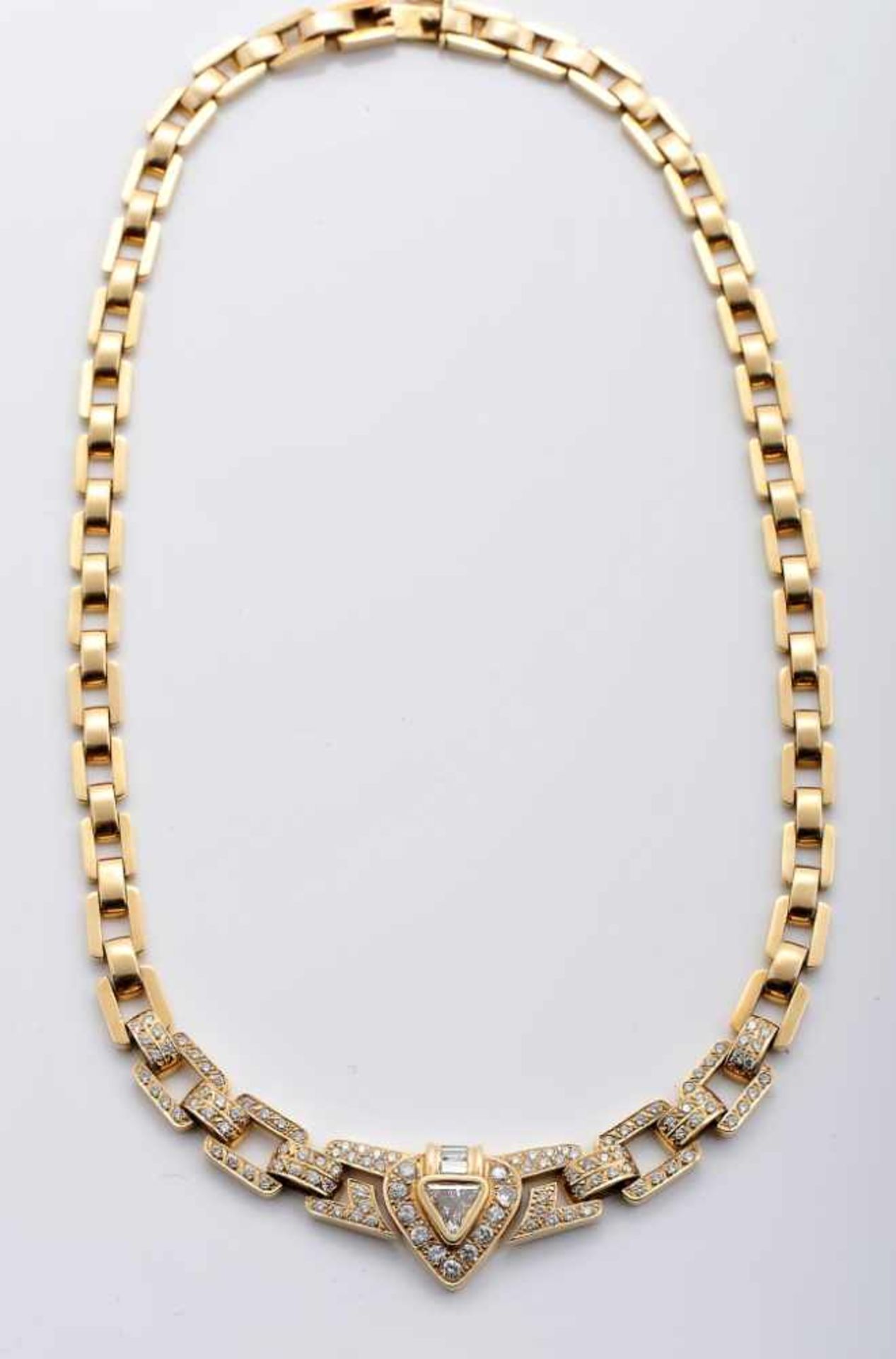 A NecklaceA Necklace, 585/1000 gold, set with 1 triangle cut diamond with an approximate weight of