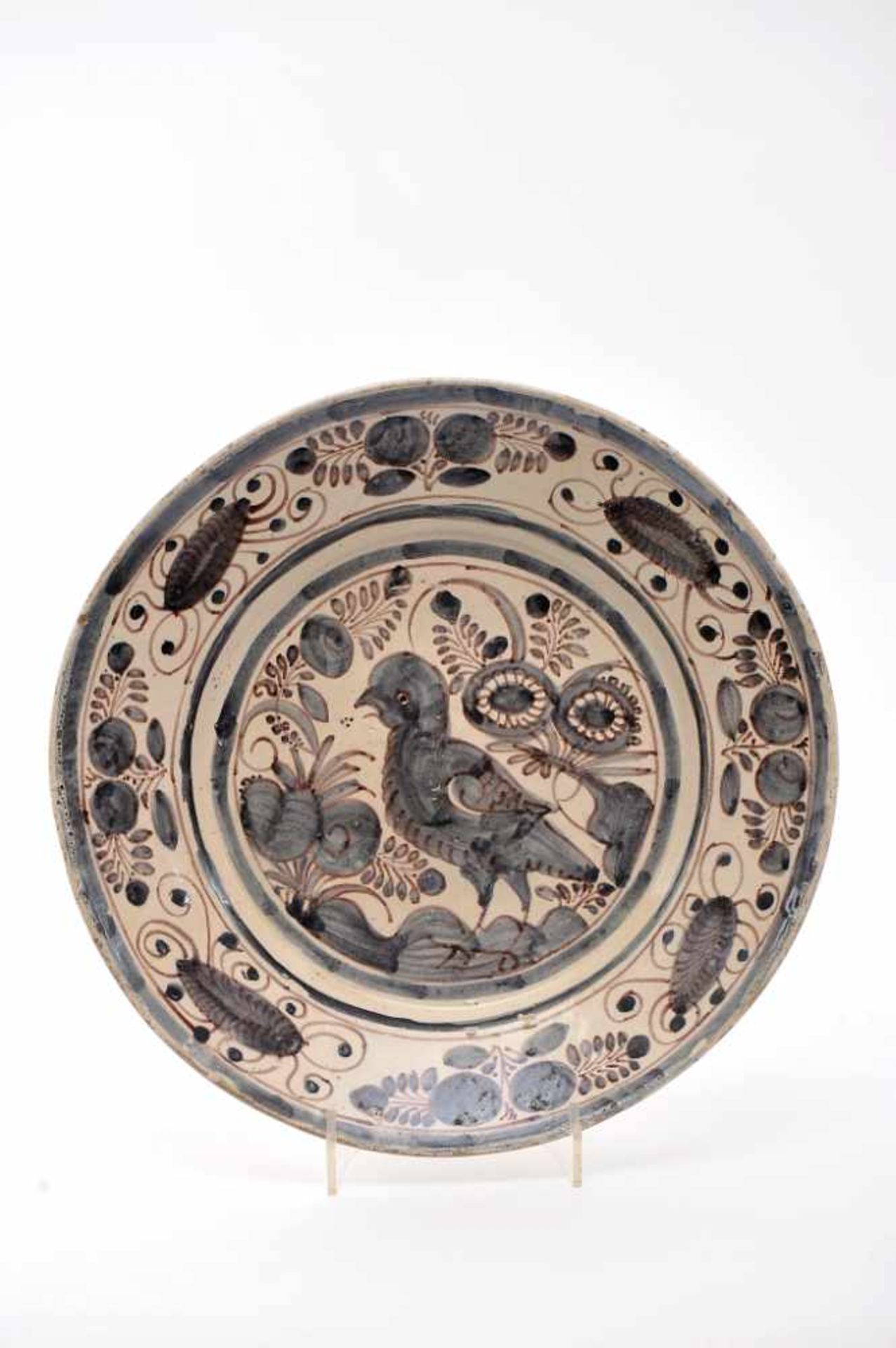 A DishA Dish, faience, blue and vinous «Aranhões» decoration "Bird among vegetation", Portuguese,