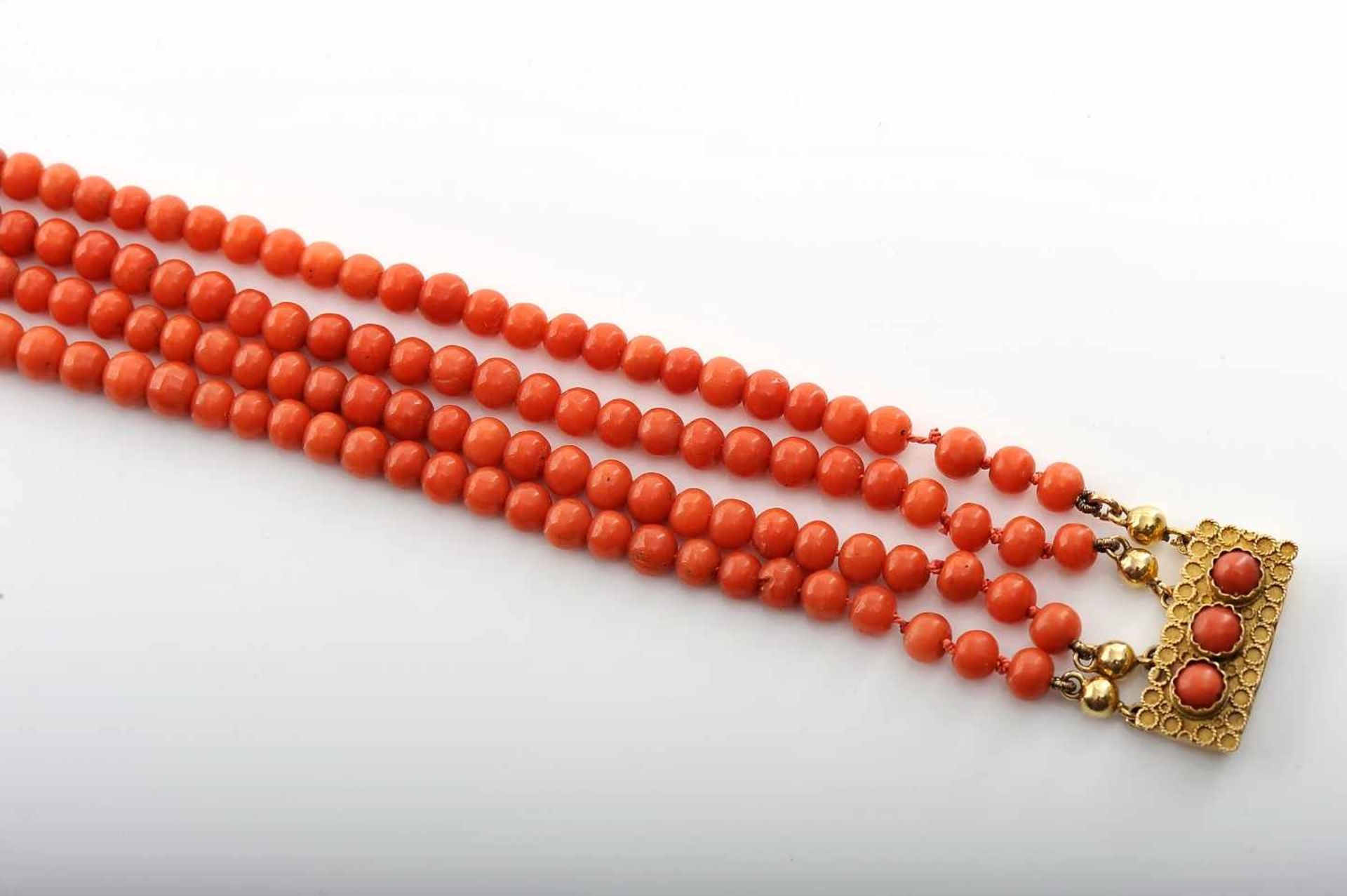 A NecklaceA Necklace, four strings of Mediterranean coral beads, 585/1000 gold clasp set with coral, - Image 2 of 2