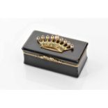 A SnuffboxA Snuffbox, tortoishell coated gold, cover with gold application "Count coronet", set with