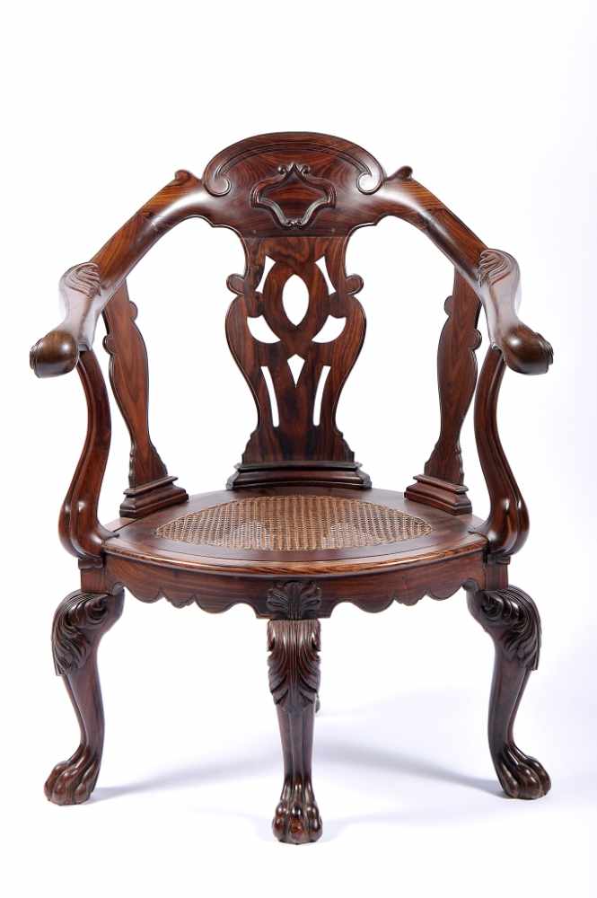 A Desk (or corner) ChairA Desk (or corner) Chair, Indian rosewood with carvings, scalloped and