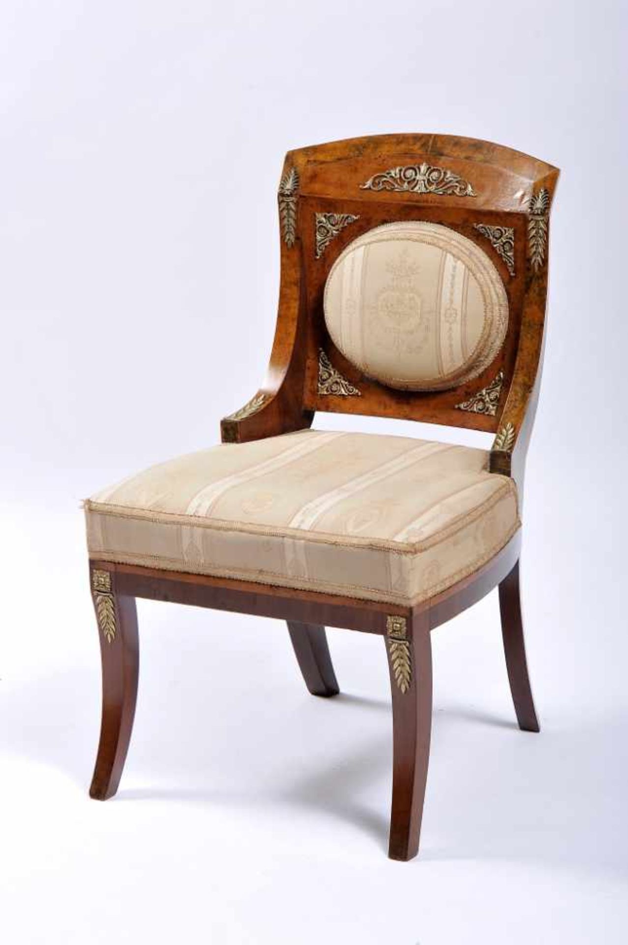 A ChairA Chair, neoclassical, walnut veneer, mahogany legs, pierced and gilt bronze applications