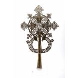 A Procession CrossA Procession Cross, scalloped, pierced and engraved brass "Crucified Christ, Saint