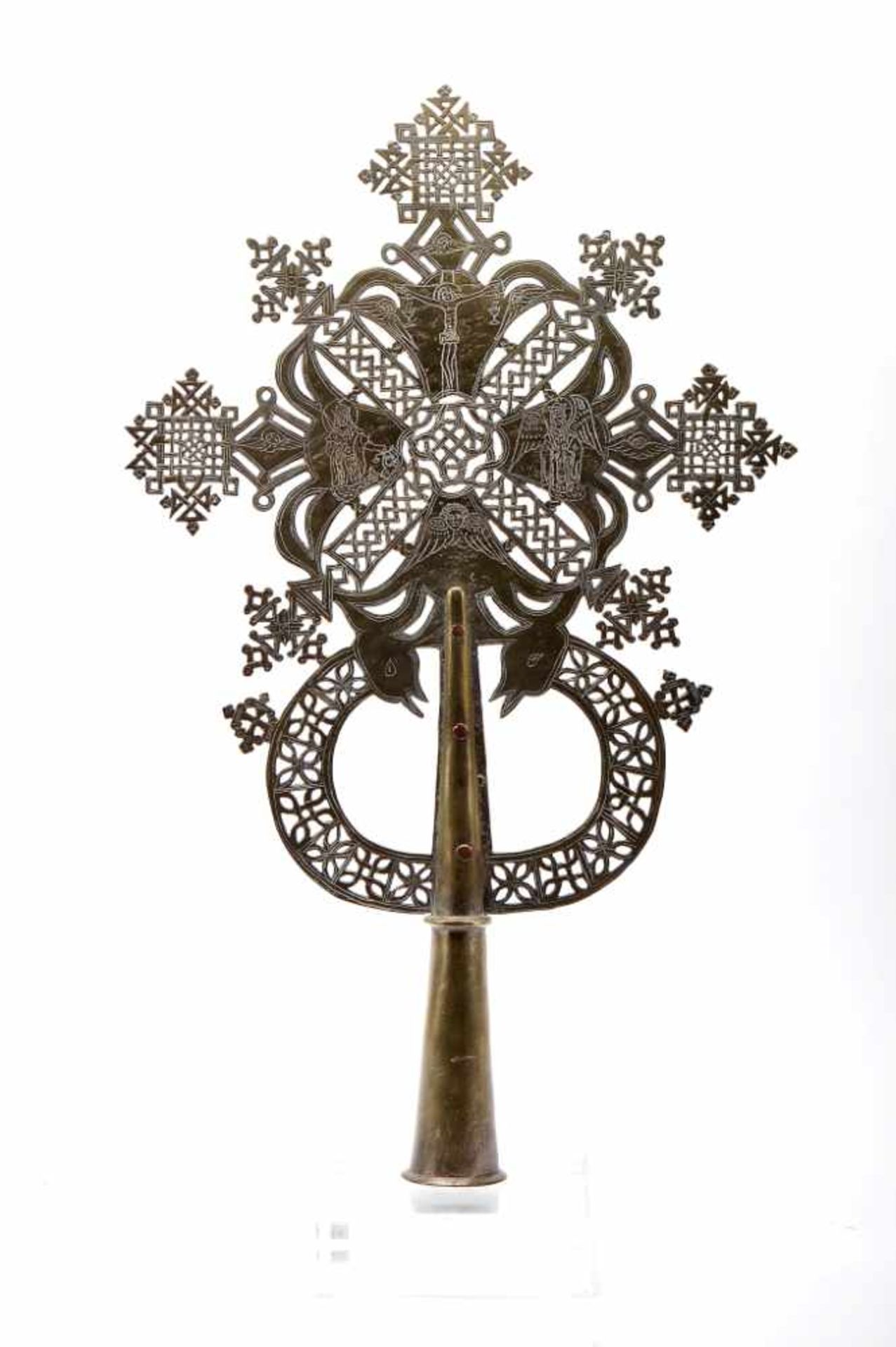 A Procession CrossA Procession Cross, scalloped, pierced and engraved brass "Crucified Christ, Saint