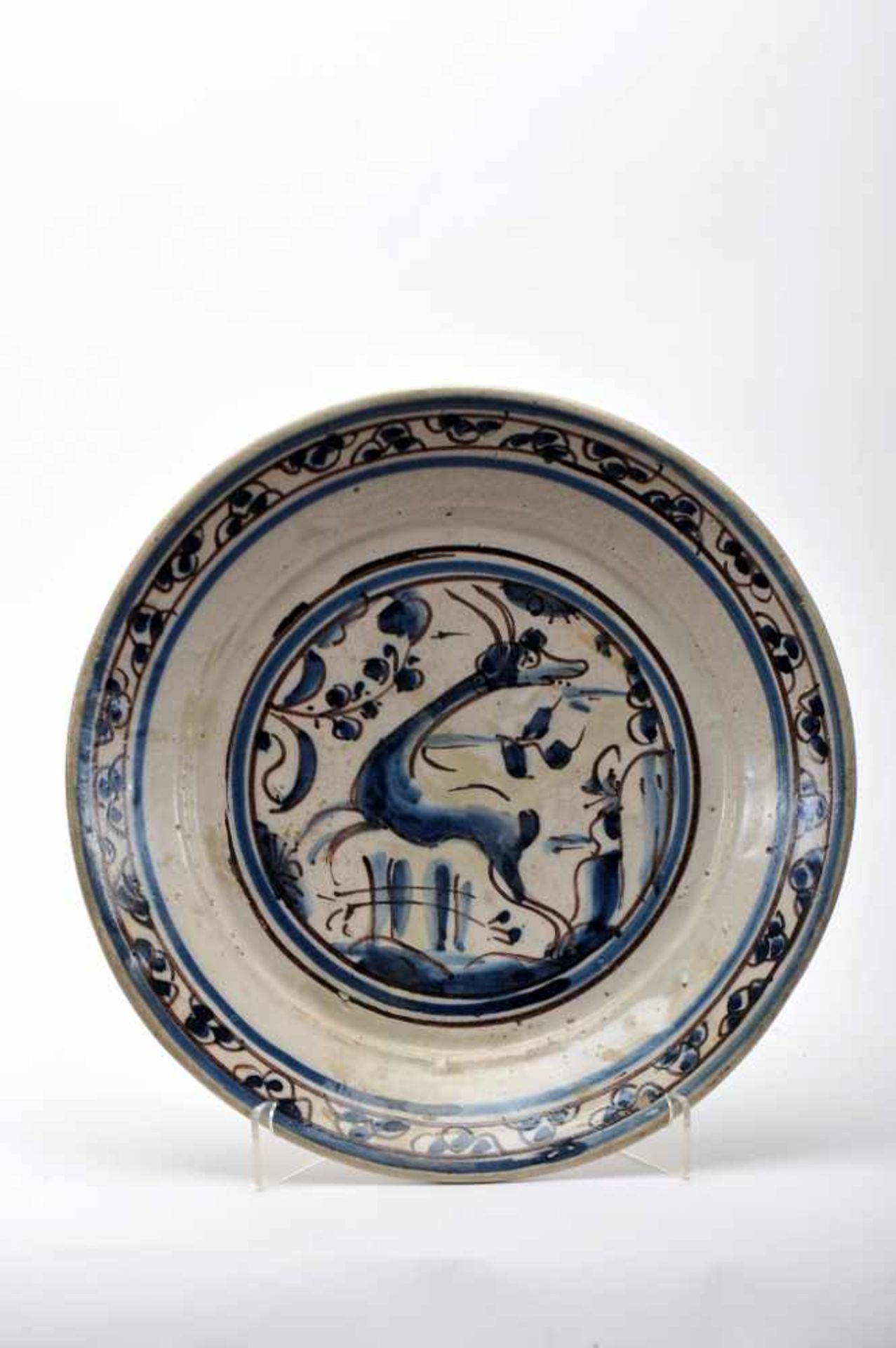 A DishA Dish, faience, blue and vinous decoration «Beads» and "Deer", Portuguese, 17th C. (2nd