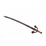 A Portuguese type «crab» swordA Portuguese type «crab» sword, wooden hilt, engraved iron guard,