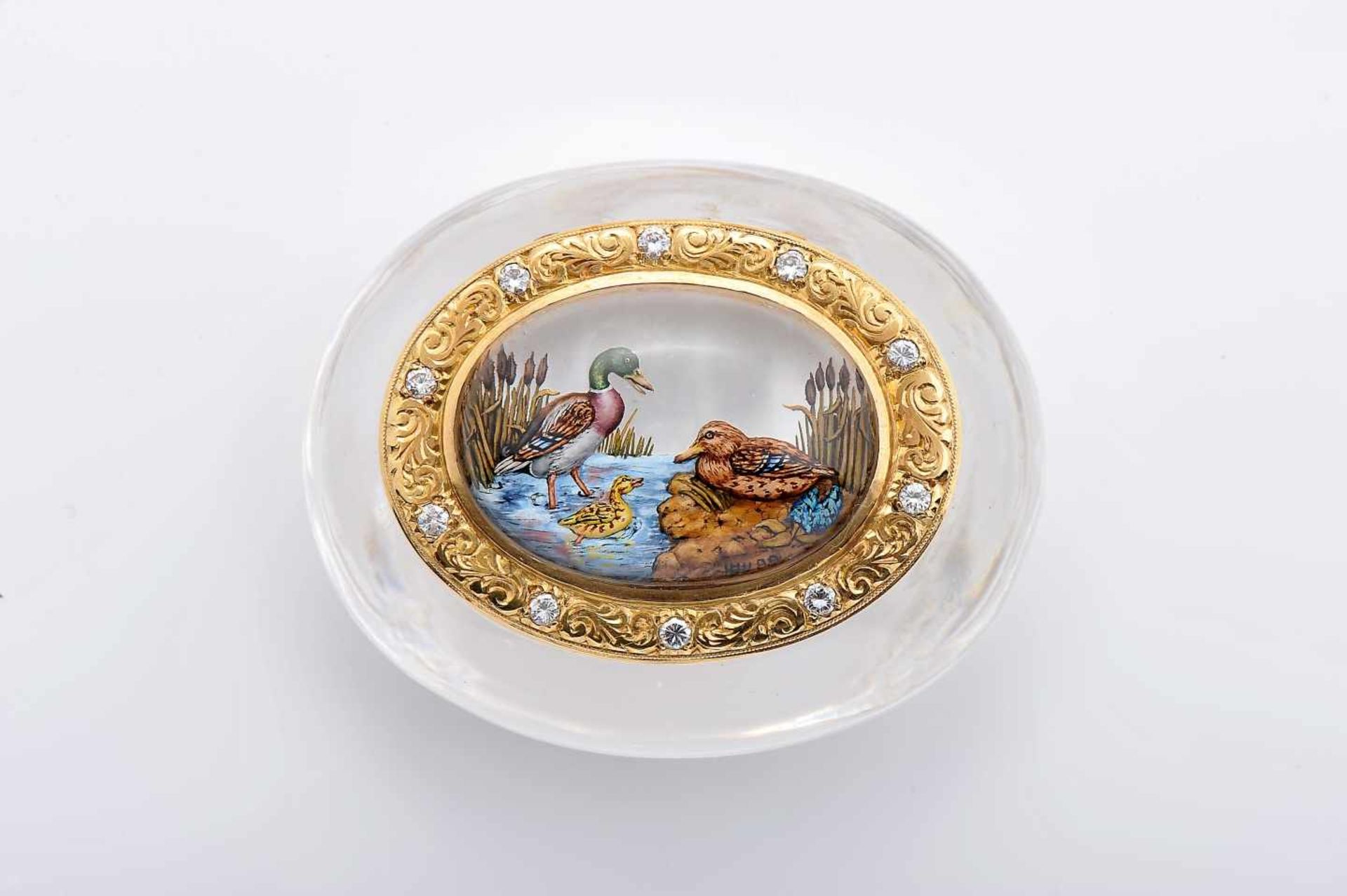 An Oval BoxAn Oval Box, rock crystal, 750/1000 gold ring and cover, application of painted rock