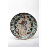 A DishA Dish, Coimbra faience known as «Ratinho», polychrome decoration "Gentleman", rim with "