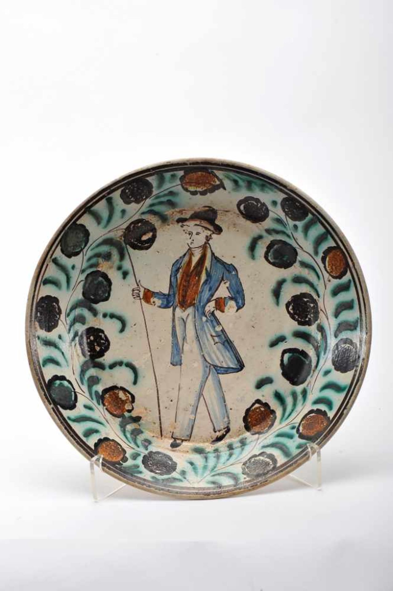 A DishA Dish, Coimbra faience known as «Ratinho», polychrome decoration "Gentleman", rim with "