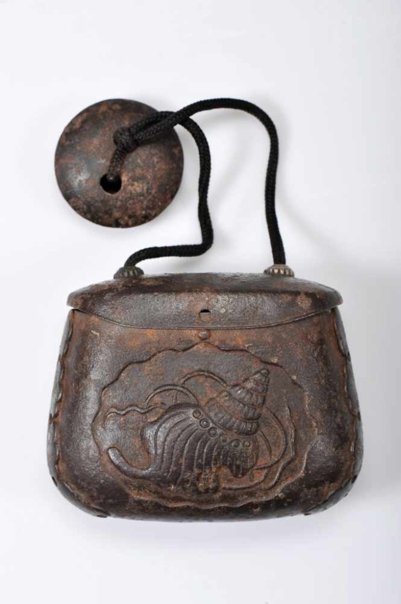 A «Tabako-Ire» - TOBACCO POUCHA «Tabako-Ire» - TOBACCO POUCH, iron worked in repoussé "Conch",