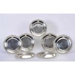 A Set of Seven ChargersA Set of Seven Chargers, 800/1000 silver, engraved rim, engravdeb medallion