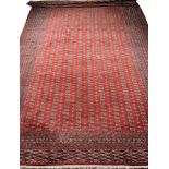 A Large "Bukhara" CarpetA Large "Bukhara" Carpet, wool yarn, polychrome decoration on burgundy