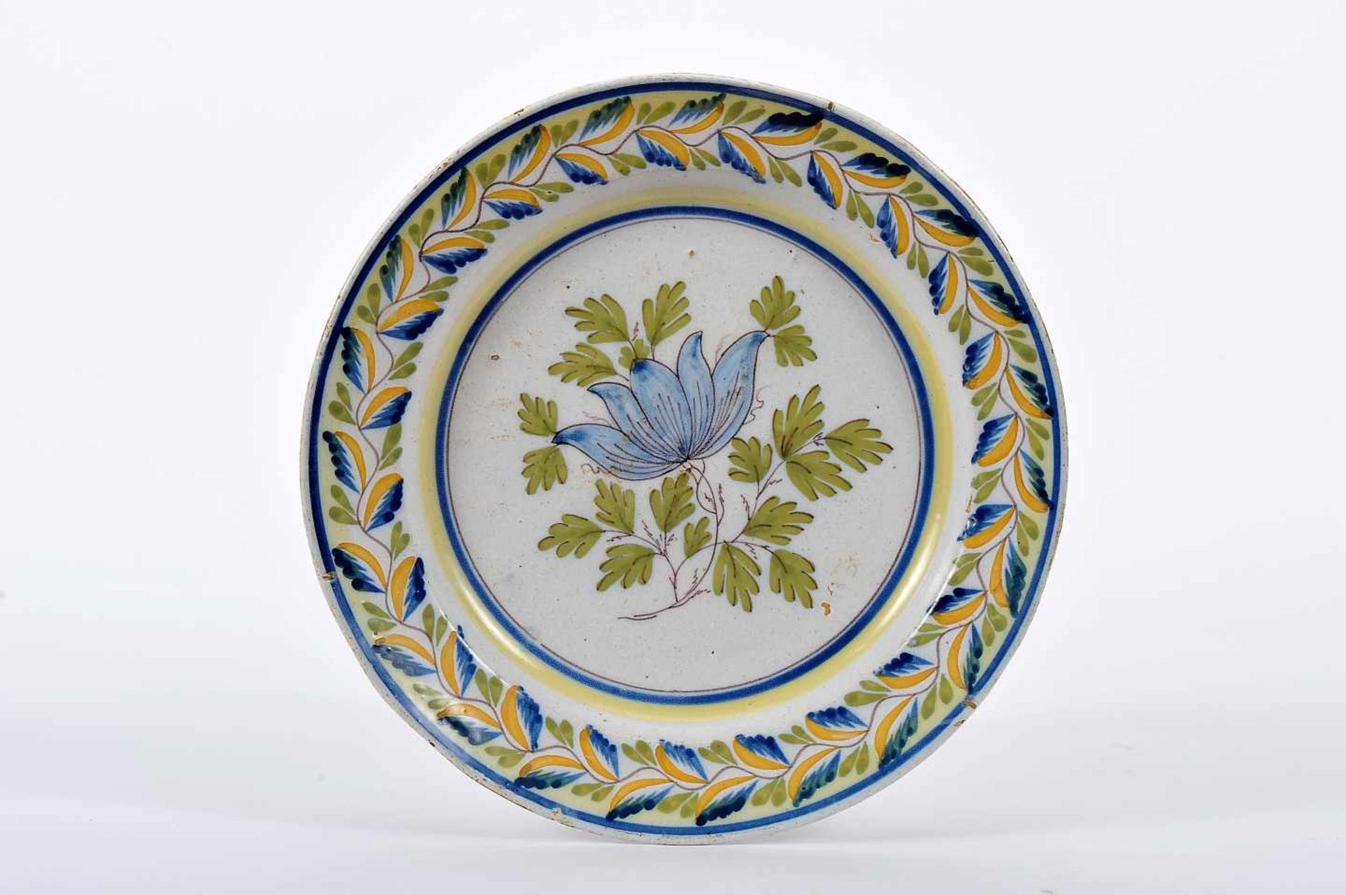 A DishA Dish, faience of Fervença, blue, green and yellow decoration "Flower and leaves",