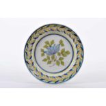 A DishA Dish, faience of Fervença, blue, green and yellow decoration "Flower and leaves",