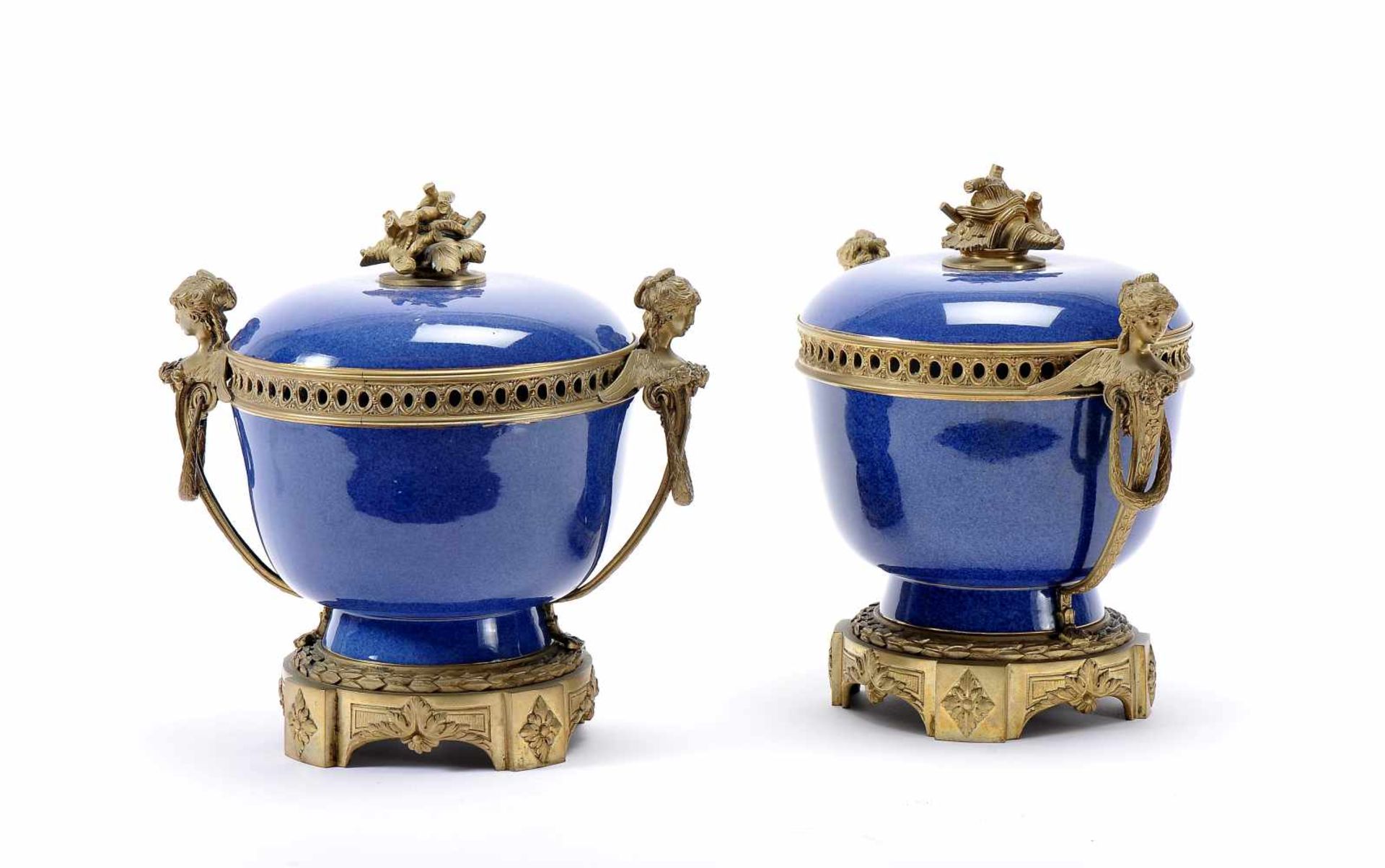 A pair of potpourri pots