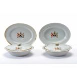 A pair of covered dishes