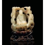 A white jade and russet group, China, Qing Dynasty - Qianlong period (1736-1796). H [...]