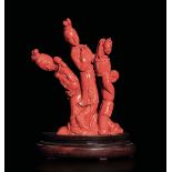 A carved coral group, China, early 1900s - Gross weight 1025gr, 24.5x16cm -