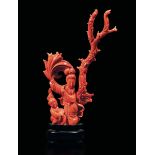 A carved red coral group, China, early 1900s - Gross weight 107gr, H 15cm -