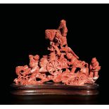 A carved coral group, China, early 1900s - Gross weight 854gr, 18.5x21cm -