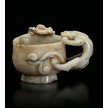 A carved jade cup, China, Ming Dynasty - 17th century. 8x9.5cm -