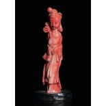 A carved coral figure, China, early 1900s - Gross weight 55gr, H 11.5cm -