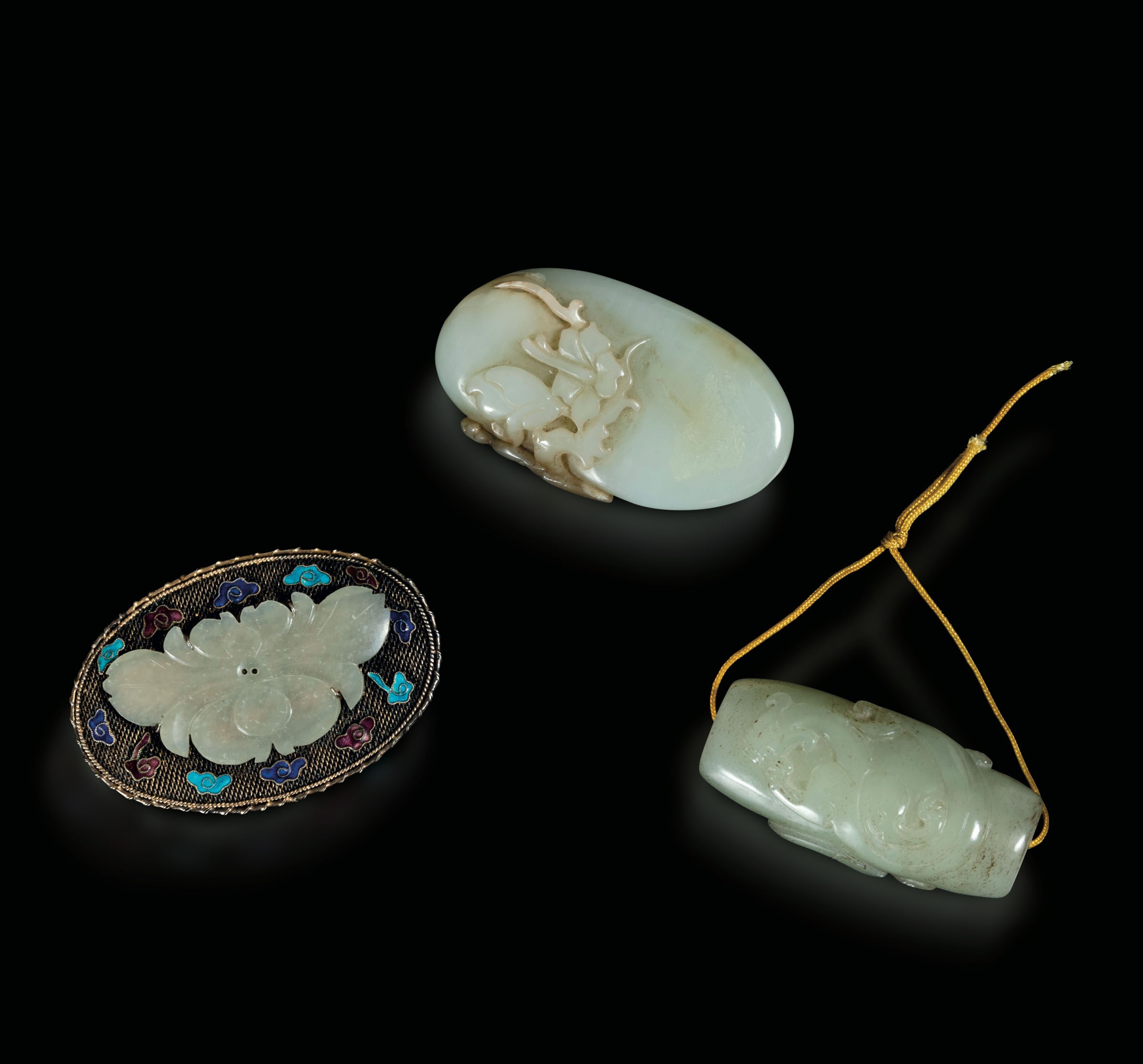 A lot of jade and silver items, China, Qing Dynasty - 19th century. Two jade pendants [...]