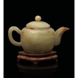 A yellow jade teapot, China, early 1900s - 10x16cm -