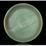 A Celadon jade plate, China, Qing Dynasty, 1800s - Apocryphal Qianlong mark. Diam [...]