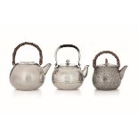 Three tea kettles, Japan, 1900s - Molten, hammered and chiselled silver. Japanese [...]