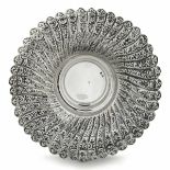 A Turkish silver dish, Turkey, 1900s - A large chiselled silver dish. 375gr, 26cm. -