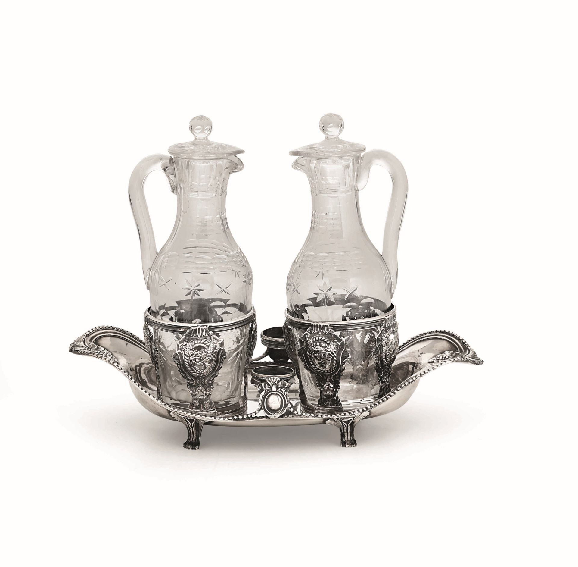 A silver cruet stand, France, late 1700s - Molten, embossed and chiselled silver with [...]